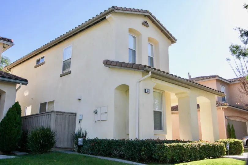 A sunny day in the area of Oak Creek, outside, fence, condo, roof, windows, tree