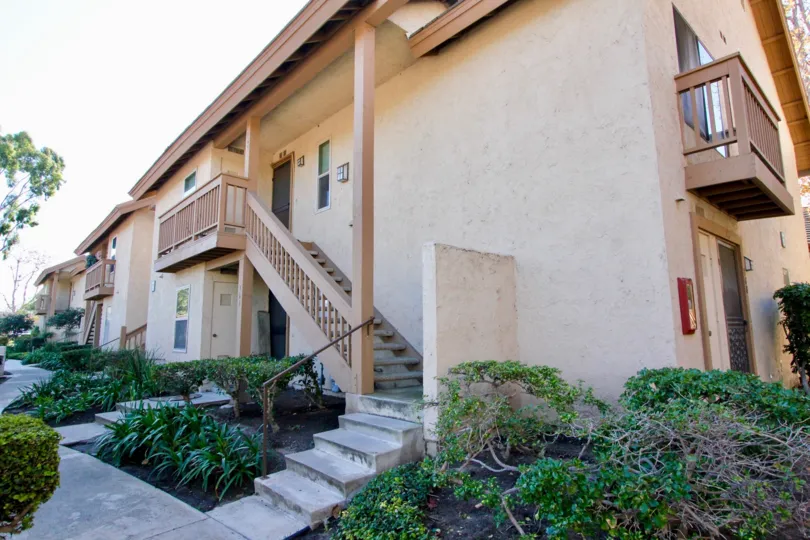 a pleasant day in the orangetree lake condos with a building that has steps in center with garden both side