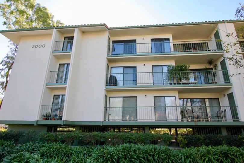 The 2000th apartment in Orangetree Terrace has balconies which has flower pots and chairs