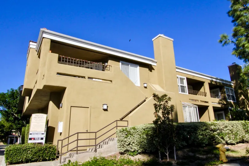 golden color building with beautiful yard of Oxford Court