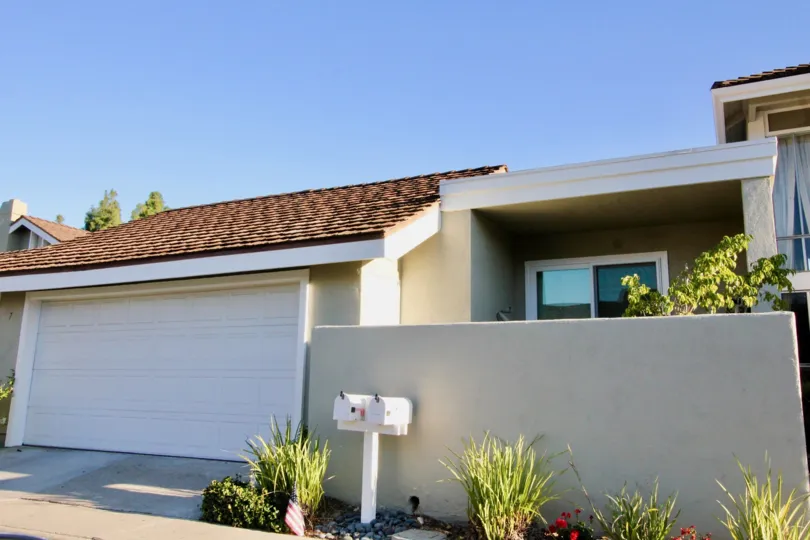 A sunny day with a massiev car parking im house at Park Home irvine, California
