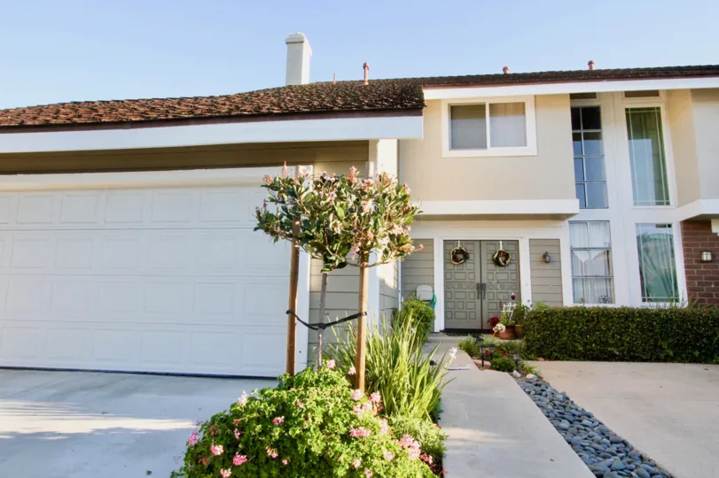 A two-storey residence in Park Homes community with brown roofing.