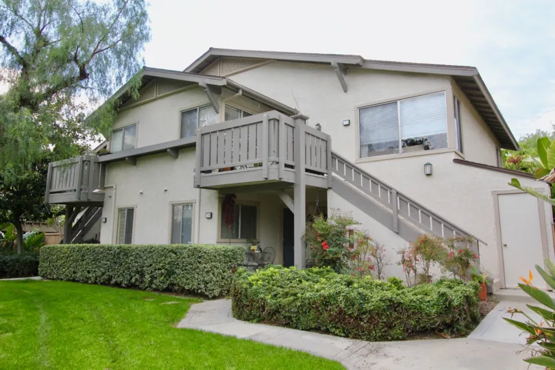 Pathway of ground floor to villa in Park Vista has meadows and bushes