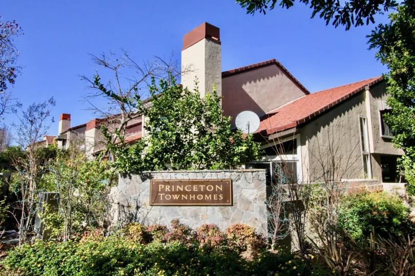 Dish antenna is attached in the house of Princeton Townhomes and attached a board with community name