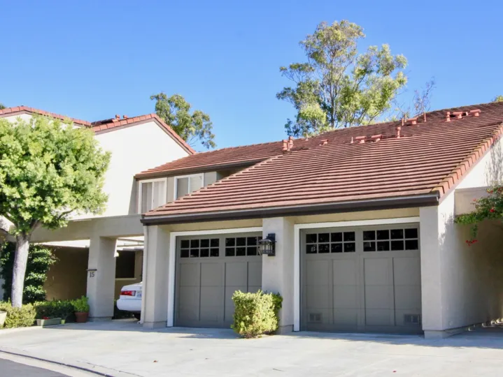 Two gray garages attached to cozy home inside Princeton Townhomes in Irvine CA