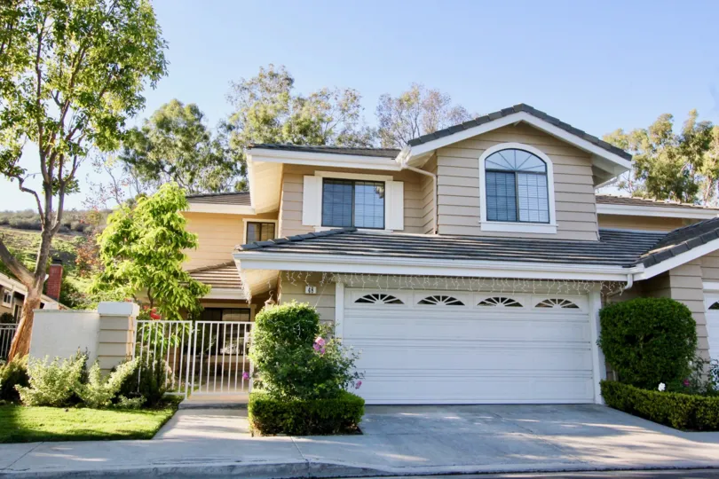 Tall trees, bushes present side to the entrance of villa in Ridge GArden Homes