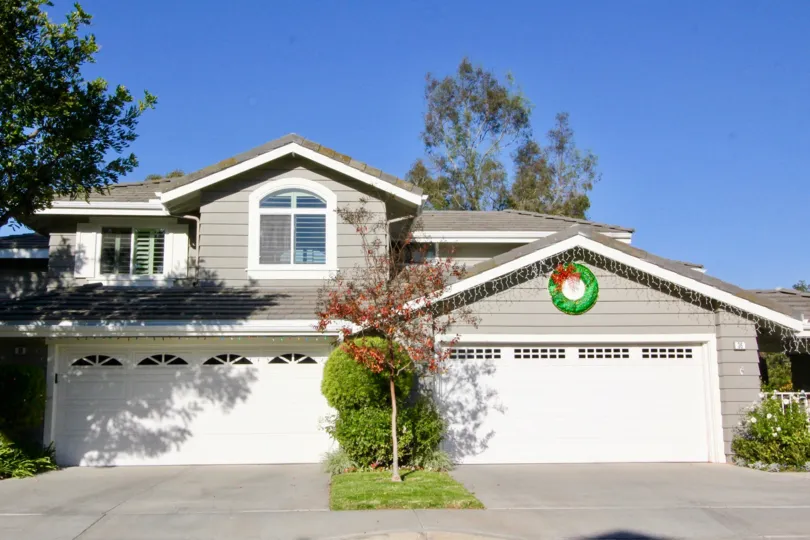 THIS IMAGE VIEWS THE HOUSE WITH SHED WITH PLANTS LOCATED IN IRVINE CITY