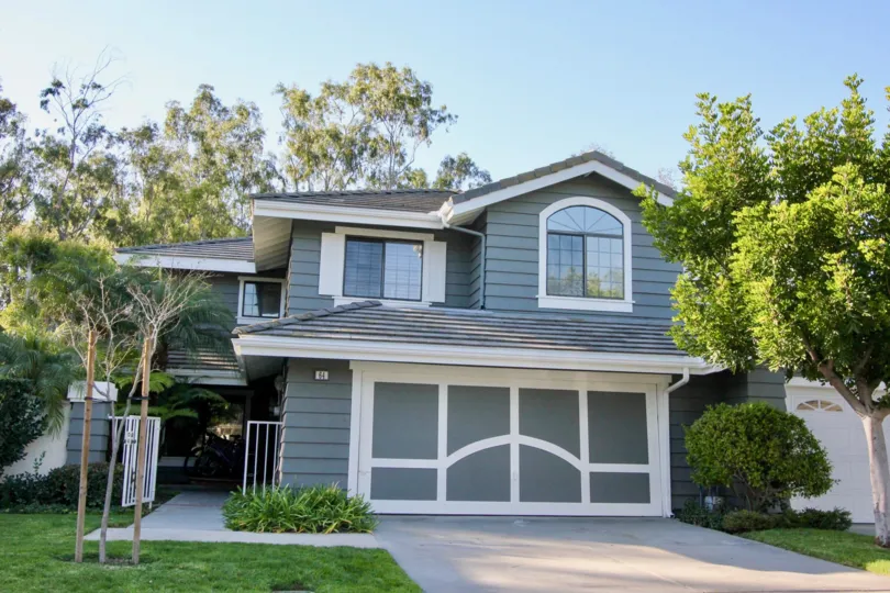 White trim decorates a gray garage door at the Ridge Garden Homes community.