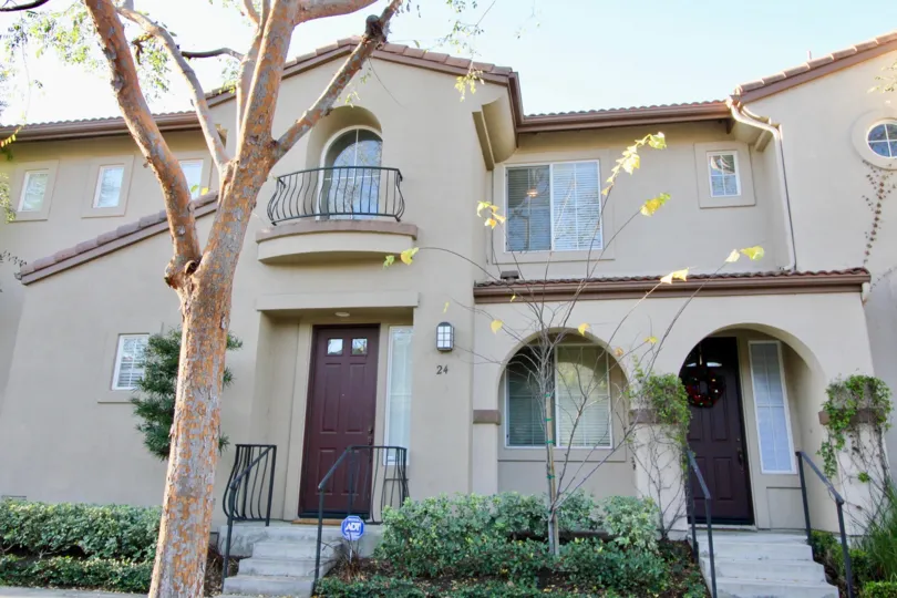 A two-storey residence in San Juan Bautista community with plum doors.