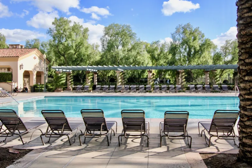 Four Sides of the Swimming Pool in San Simeon has seating chairs