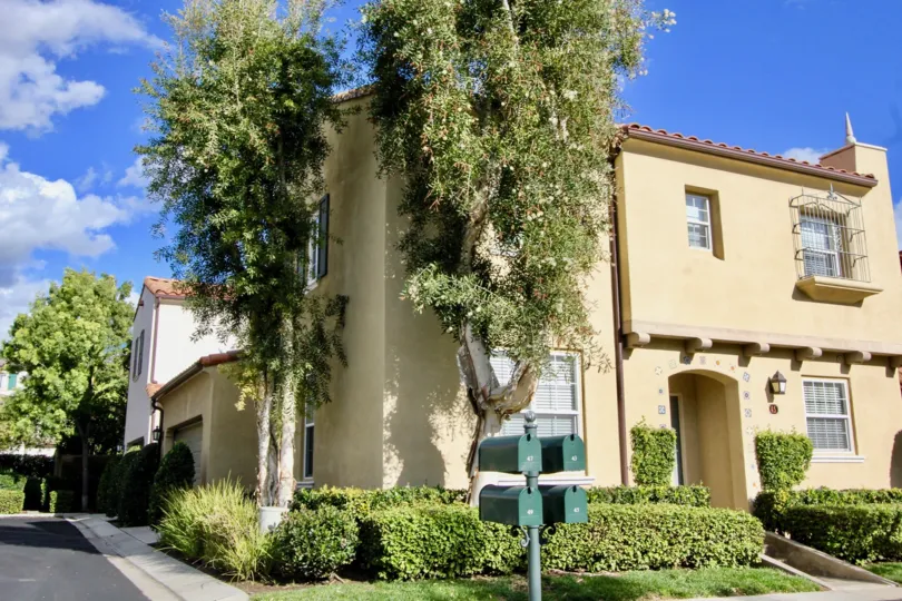 Four Postal boxes is placed in the San simeon with tallest trees over house