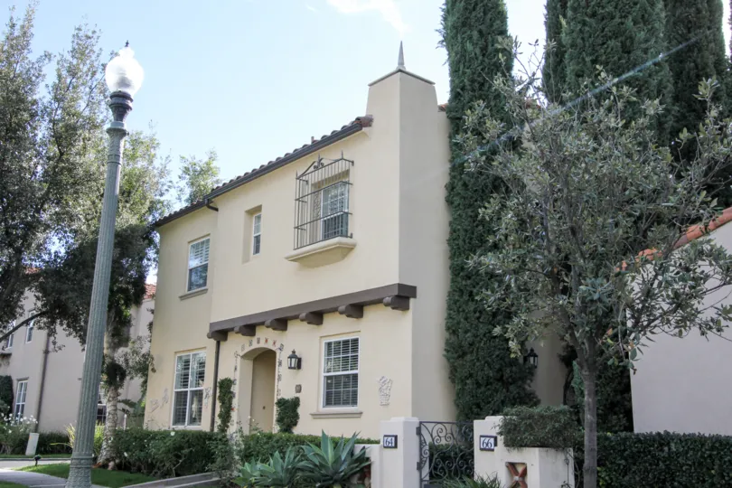 A sunny day in the area of San Simeon, outside, condo, lightpole, trees, gated windows, roof