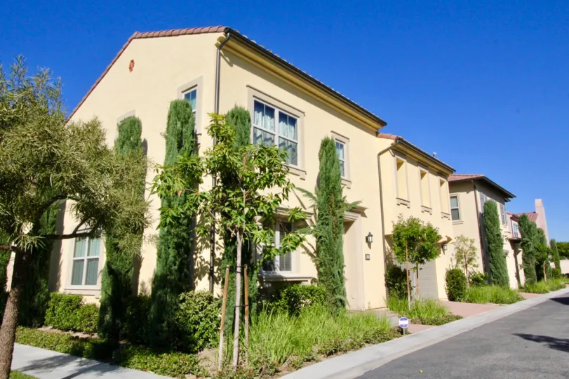 A row house with two floor with tall trees in Santa Cruz, Irvine, California