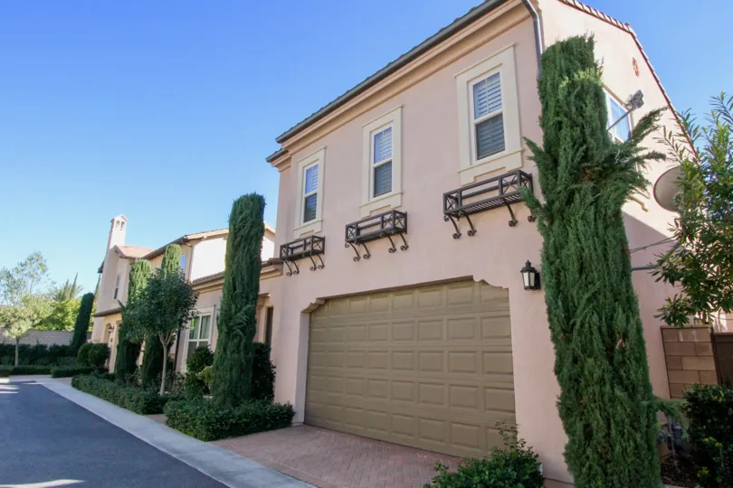 a sunny day and a huge house surrounded by trees in Santa Cruz irvine california