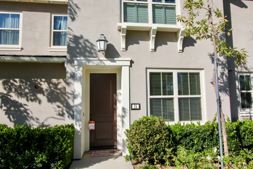 Gray apartment complex with white framed windows in Irvine California