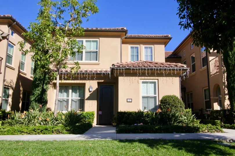 A sunny day in the area of Santa Rosa, outside, trees, grass, sidewalk, condo, door, lights, balcony