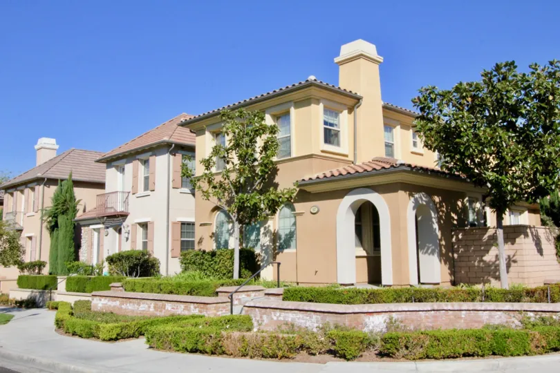 A lavish corner view of a Stonetree Manor community with different themed houses.