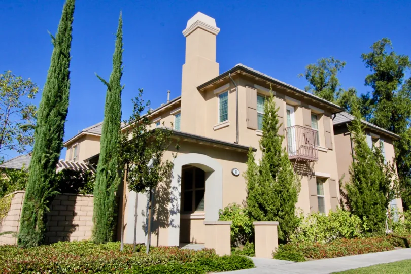 A large house surrounded by trees in the Stonetree Manor neighborhood of Irvine, CA