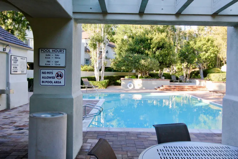 Pool hours showing in swiming Pool At Community Summit Towne Collection, Irvine, California