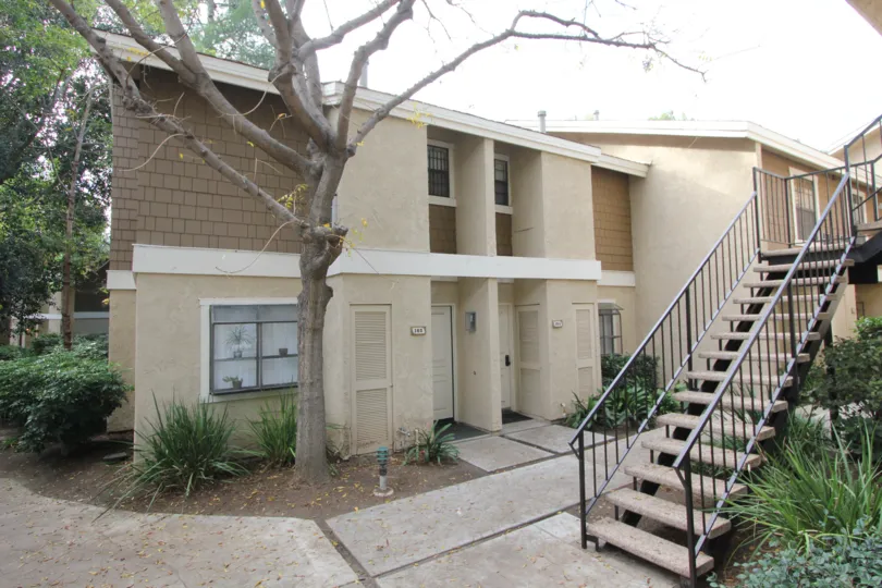 A sunny day in the area of The Lakes, outside, condo, balcony, roof, trees