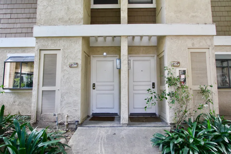 A two-unit view in the Lakes community with arbored entrance.