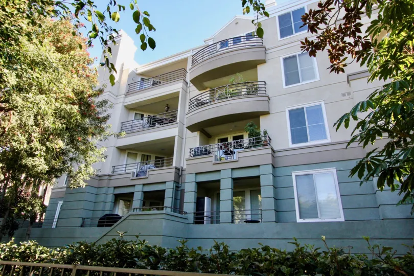 Four The Metropolitan balconies overlooking a green landscape in Irvine, California