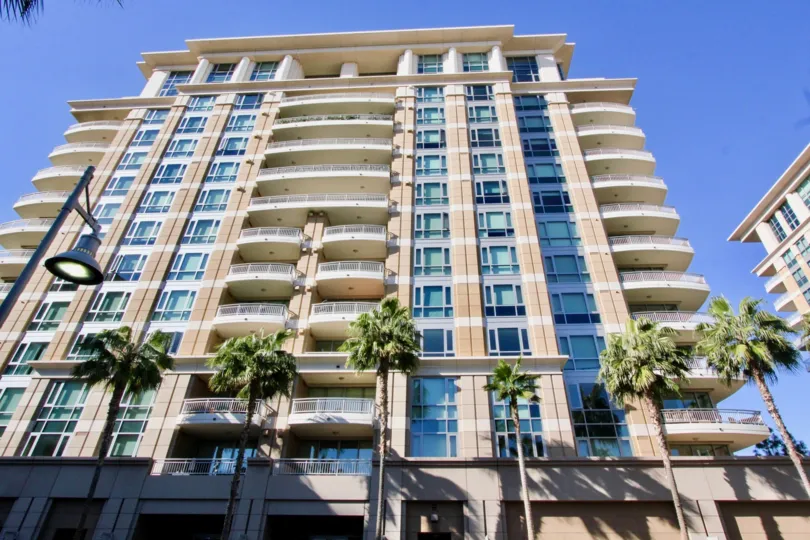 Sunny day looking up at The Plaza Irvine, a 12 story building in Irvine, California