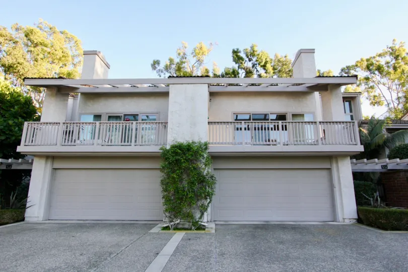 A sunny day in the area of Turtle Rock Crest, outside, condo, balcony, garage, trees