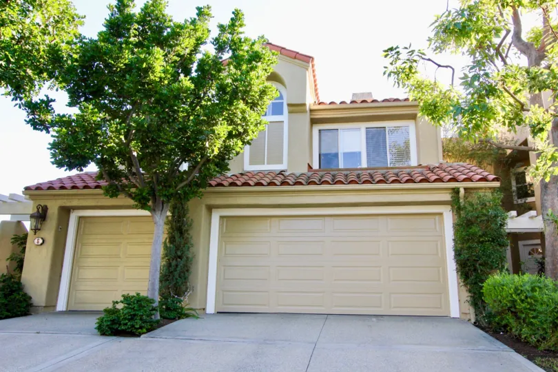 A two-storey unit in the Turtle Rock Pointe community with three carport.