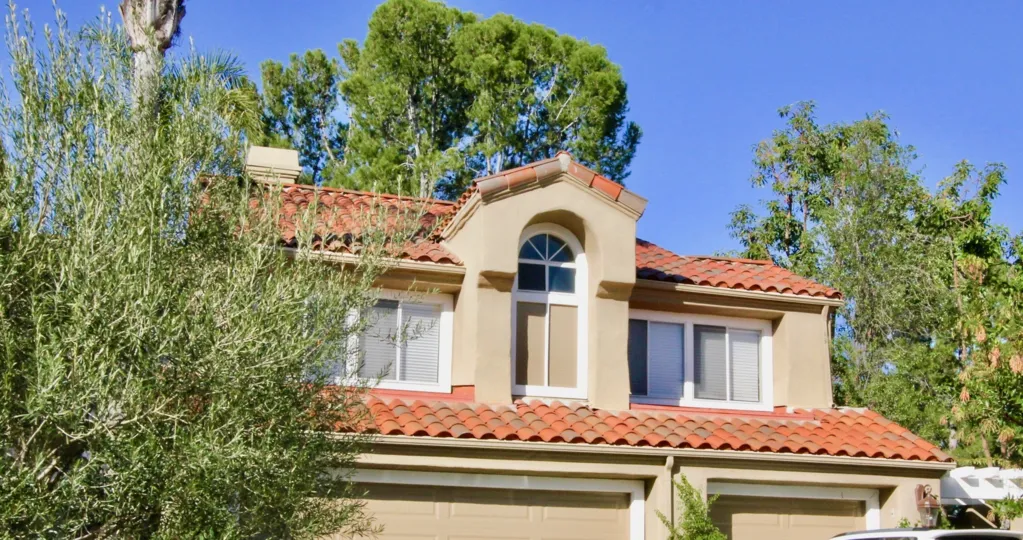 The upper story of a home in Turtle Rock Pointe on a sunny day