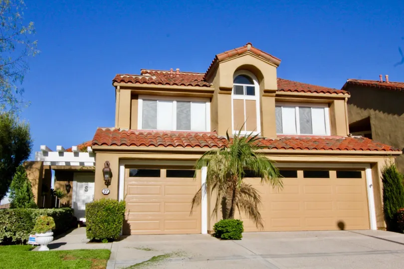 A street view of a home and garage in Turtle Rock Pointe neighborhood