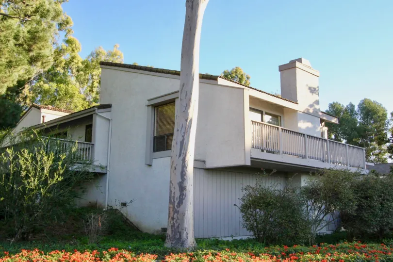 THE HOUSE IN THE TURTLE ROCK VISTA WITH THE BALCONIS, PLANTS, TREES