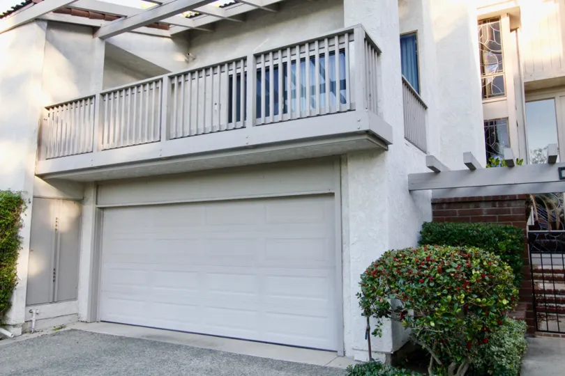 A sunny day in the area of Turtle Rock Crest, outside, condo, balcony, garage, brick