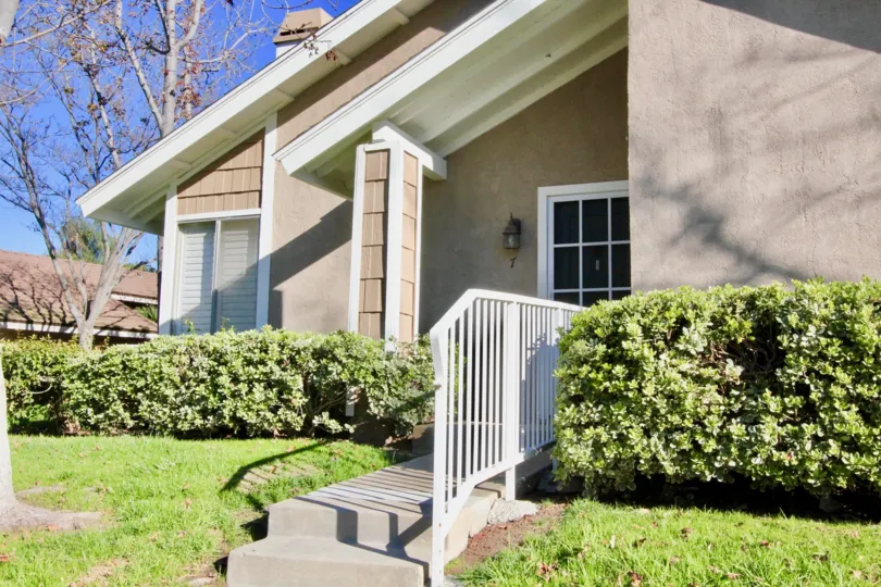 House with fence and bushes outside in Village Glen, Irvine CA
