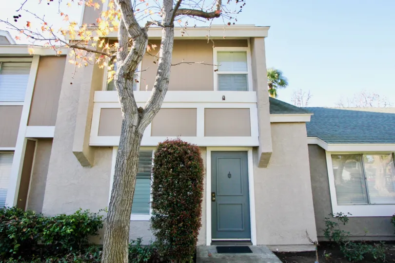 A two-storey residence in the Village Glen neighborhood painted in beige.