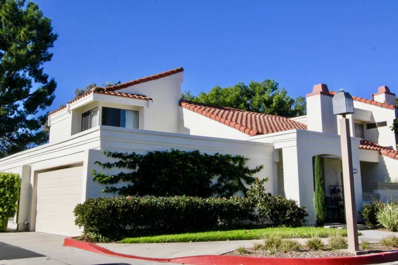 A traditional two-storey residence in the Villas at RSJ community with crazy pitched roofs.