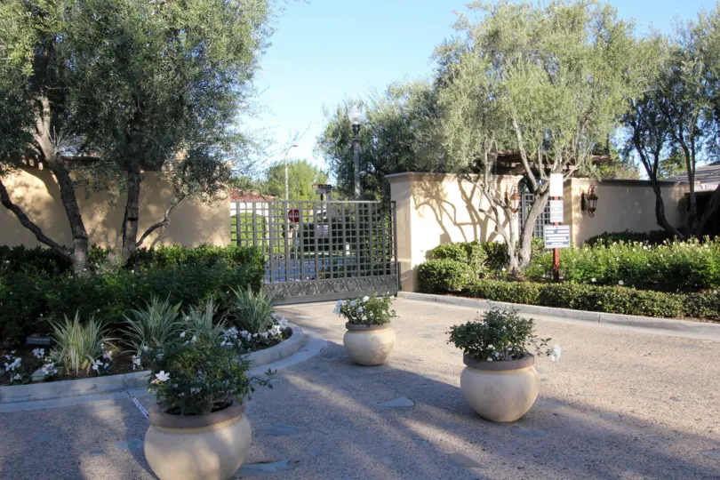 THIS IMAGE SHOWS THE ENTRANCE IN IRVINE CITY, WHICH SHOWS THE LOT OF TREES, PLANTS WITH FLOWERS ARE THERE
