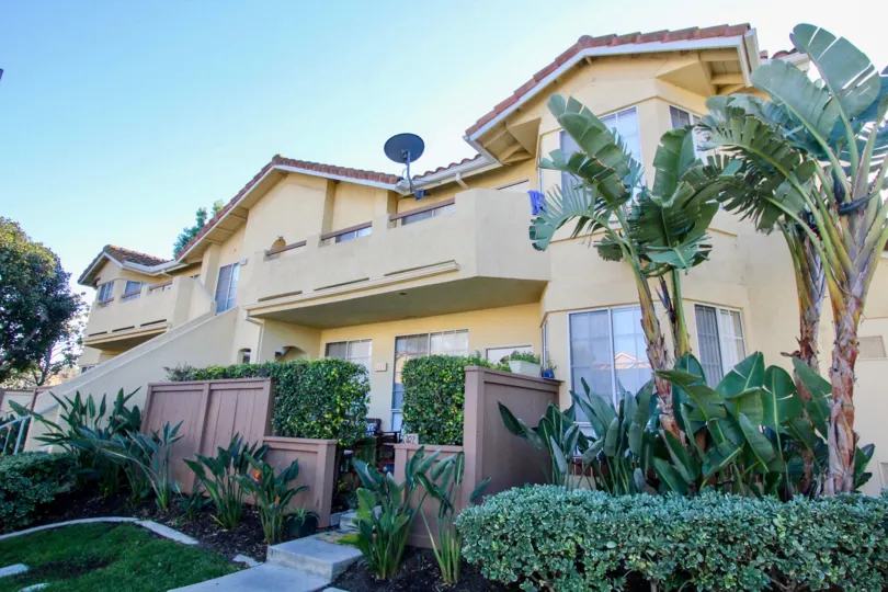 A two-storey townhouse with exterior staircase in the Vista West Park community