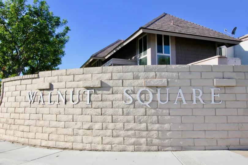 Beautiful villa with trees and name depicting in Walnut Square of Irvine