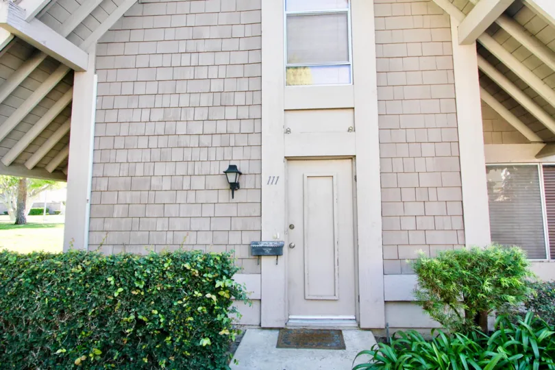 A sunny day in the area of Walnut Square, outside, door, mailbox, light, window, bushes