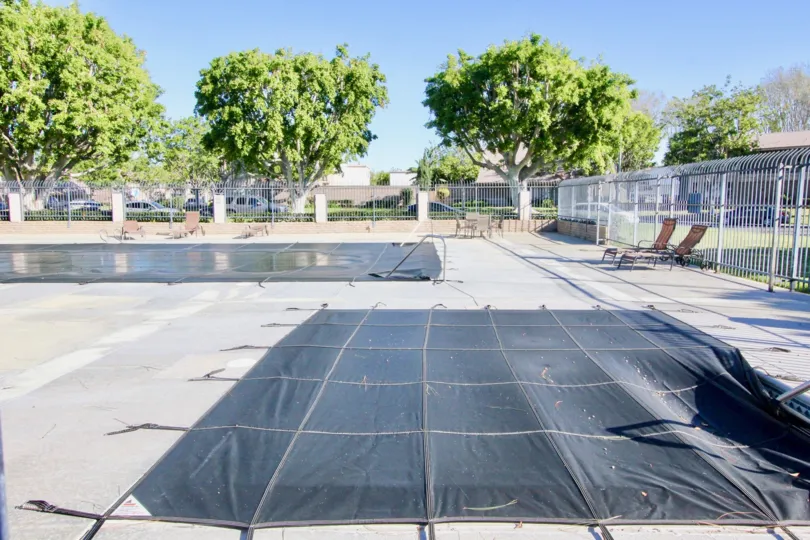A view of the closed pool area on a sunny day in Walnut Square