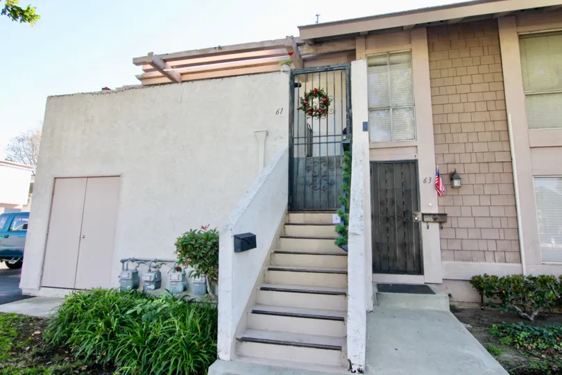 A two-storey unit in the Walnut Square community with gated exterior staircase.