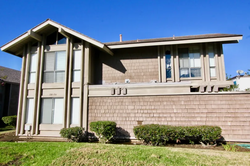 A side view of two-storey residence with vertical design in the Walnut Square community.