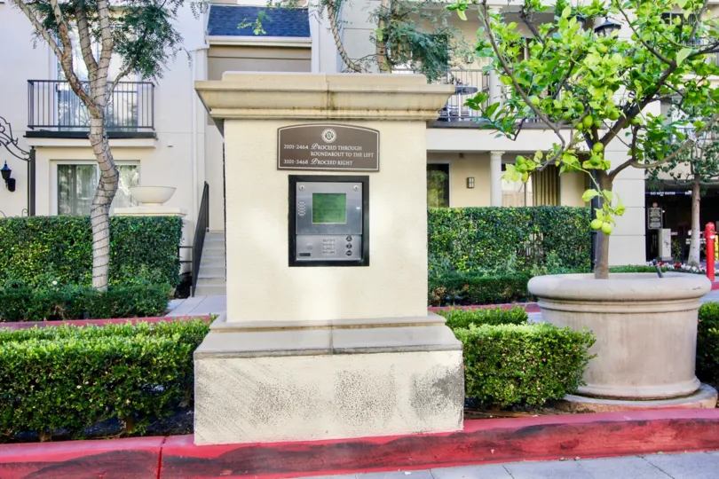 Entry to apartment complex with trees in Watermarke, Irvine CA