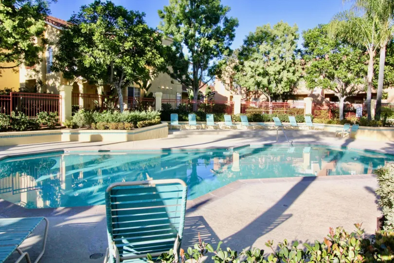 vacation rental pool complex tan relax shade trees