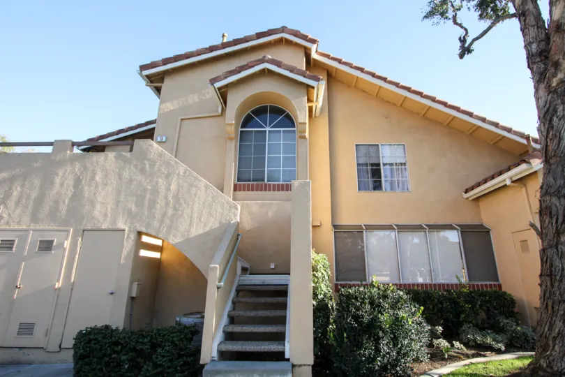 A two-storey unit in the Westpark Tiempo community with slab railings and tiled roofing.