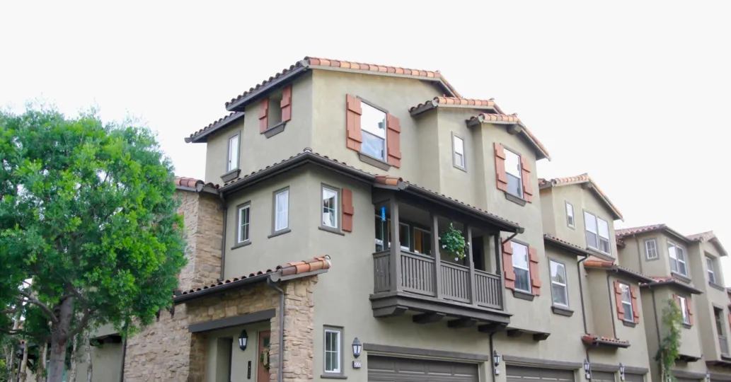 A sunny day in the area of Whispering Glen, outside, condo, balcony, plants. windows, roof
