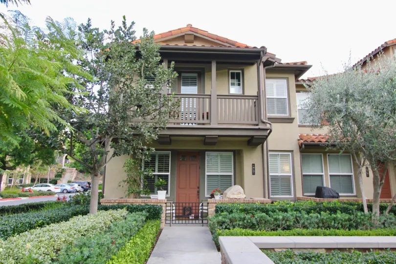 A two-storey residence in Whispering Glen community with brown railings