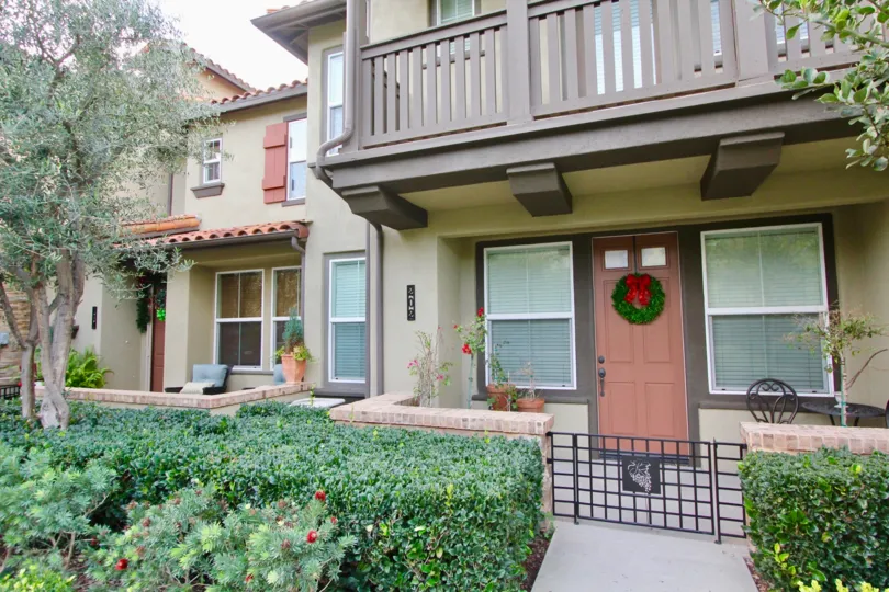 The front area of a home in Whispering Glen with its landscaping and honiday decor