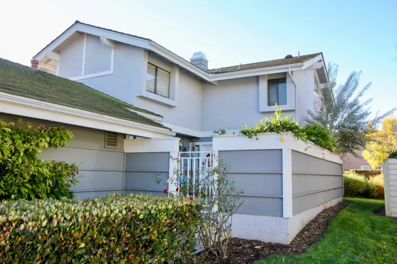 A two-storey residence in Willow Creek community with moldy roof.